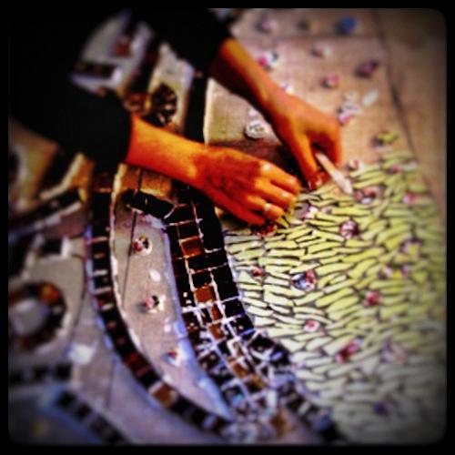 Artist making a mosaic