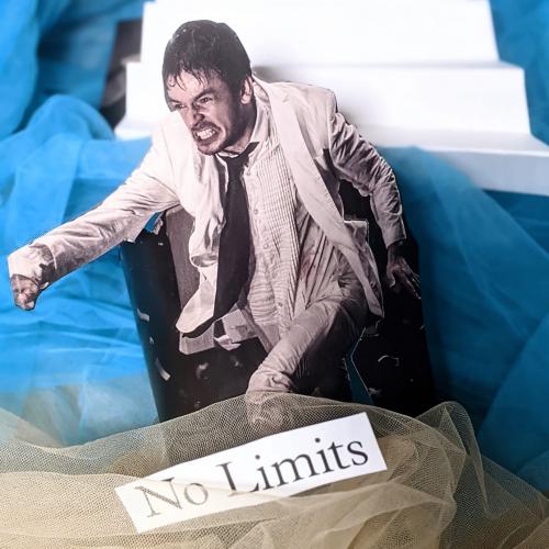 Man fighting his way forwards with text 'No Limits'
