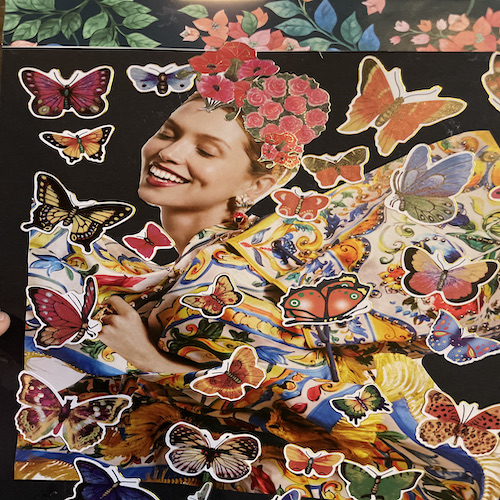 Woman covered in butterflies