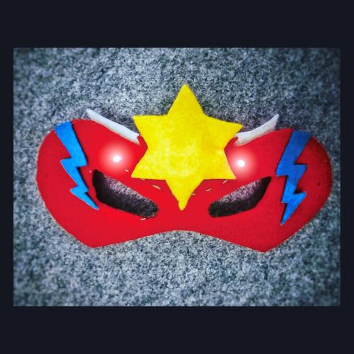 Felt DIY super-hero mask with LEDs sewn on either sides of a 2cm yellow stars to add some light as a special effect